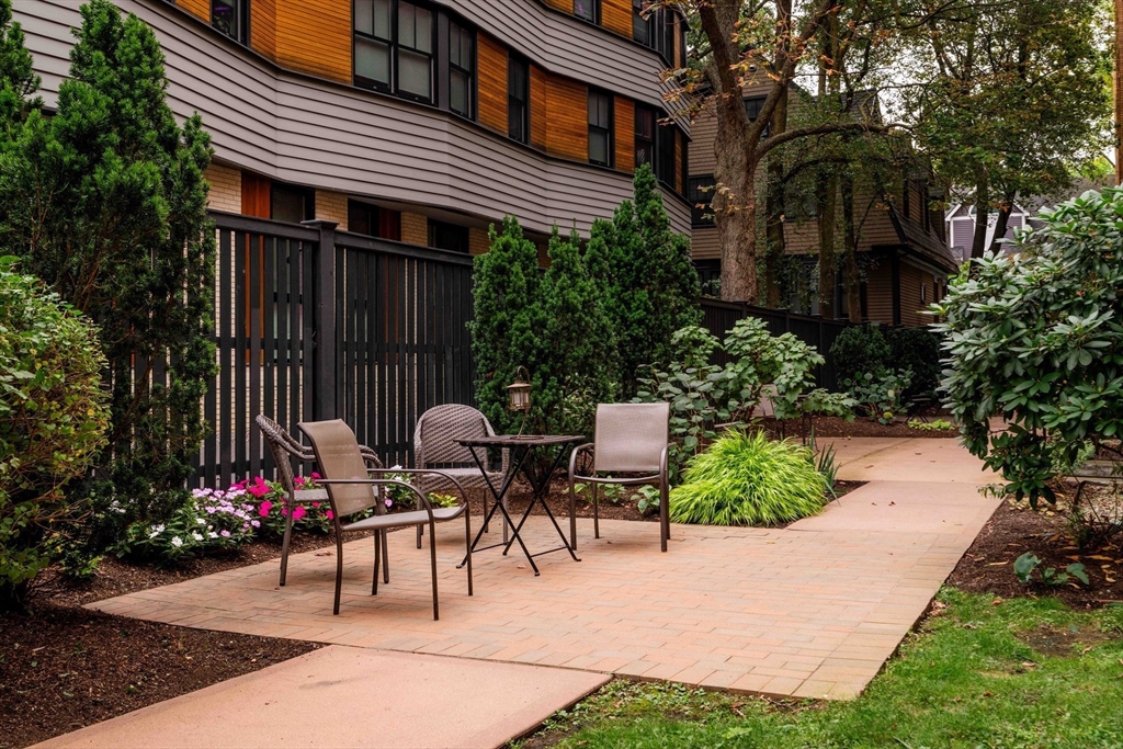 4 Newport Road, Unit 7 Cambridge, MA 02140 - Photo 29 of 31 a view of a house with backyard and sitting area