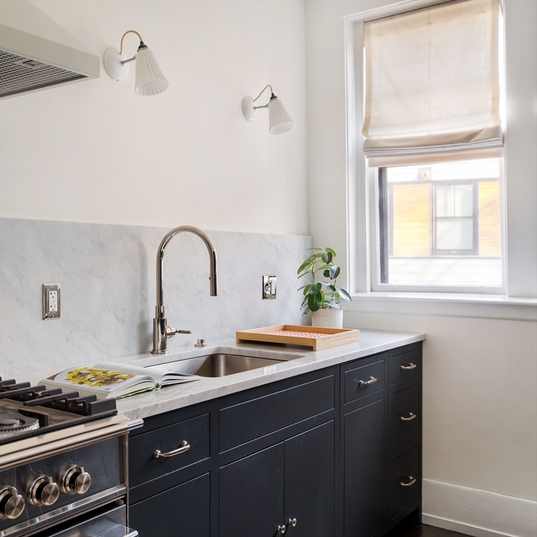 4 Newport Road, Unit 7 Cambridge, MA 02140 - Photo 4 of 31 a kitchen with a sink and cabinets