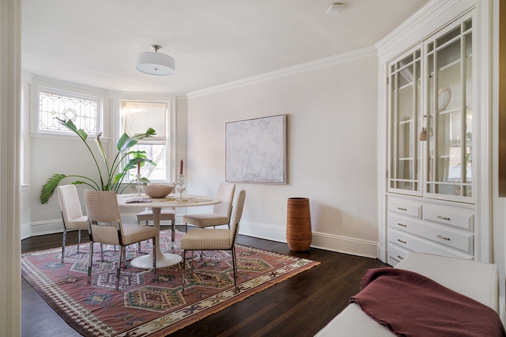 4 Newport Road, Unit 7 Cambridge, MA 02140 - Photo 6 of 31 a dining room with furniture and wooden floor