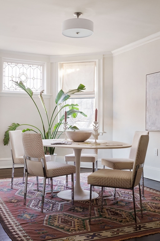 4 Newport Road, Unit 7 Cambridge, MA 02140 - Photo 7 of 31 a view of a dining room with furniture window and wooden floor