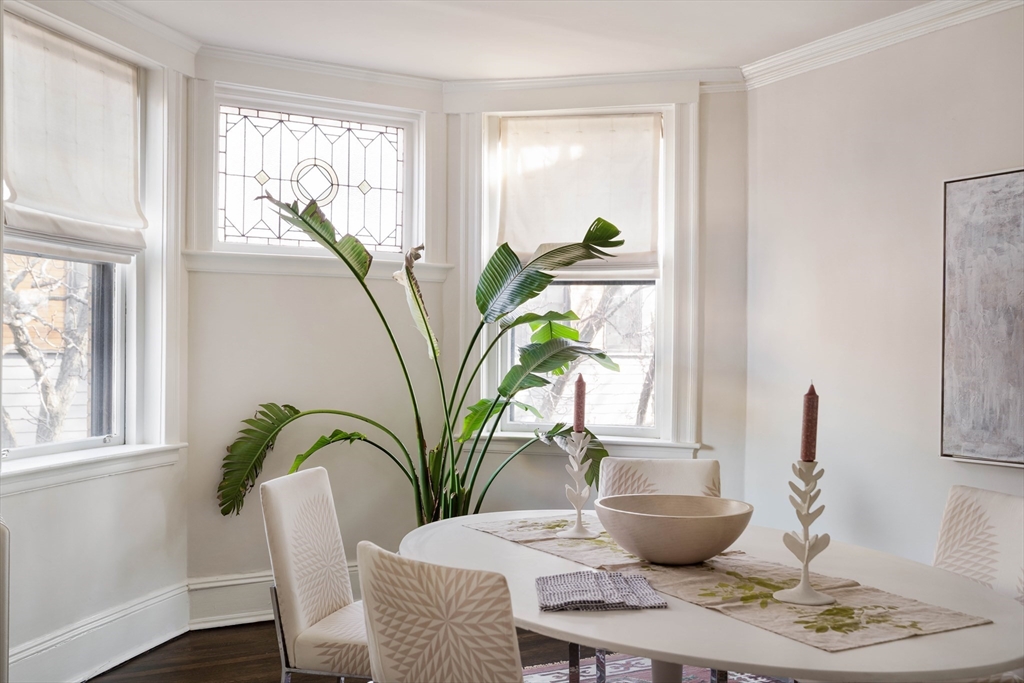 4 Newport Road, Unit 7 Cambridge, MA 02140 - Photo 8 of 31 a dining room with furniture potted plants and wooden floor