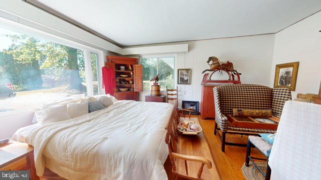 19 Valley Road Lewistown, PA 17044 - Photo 20 of 37 a bedroom with a bed and wooden floor