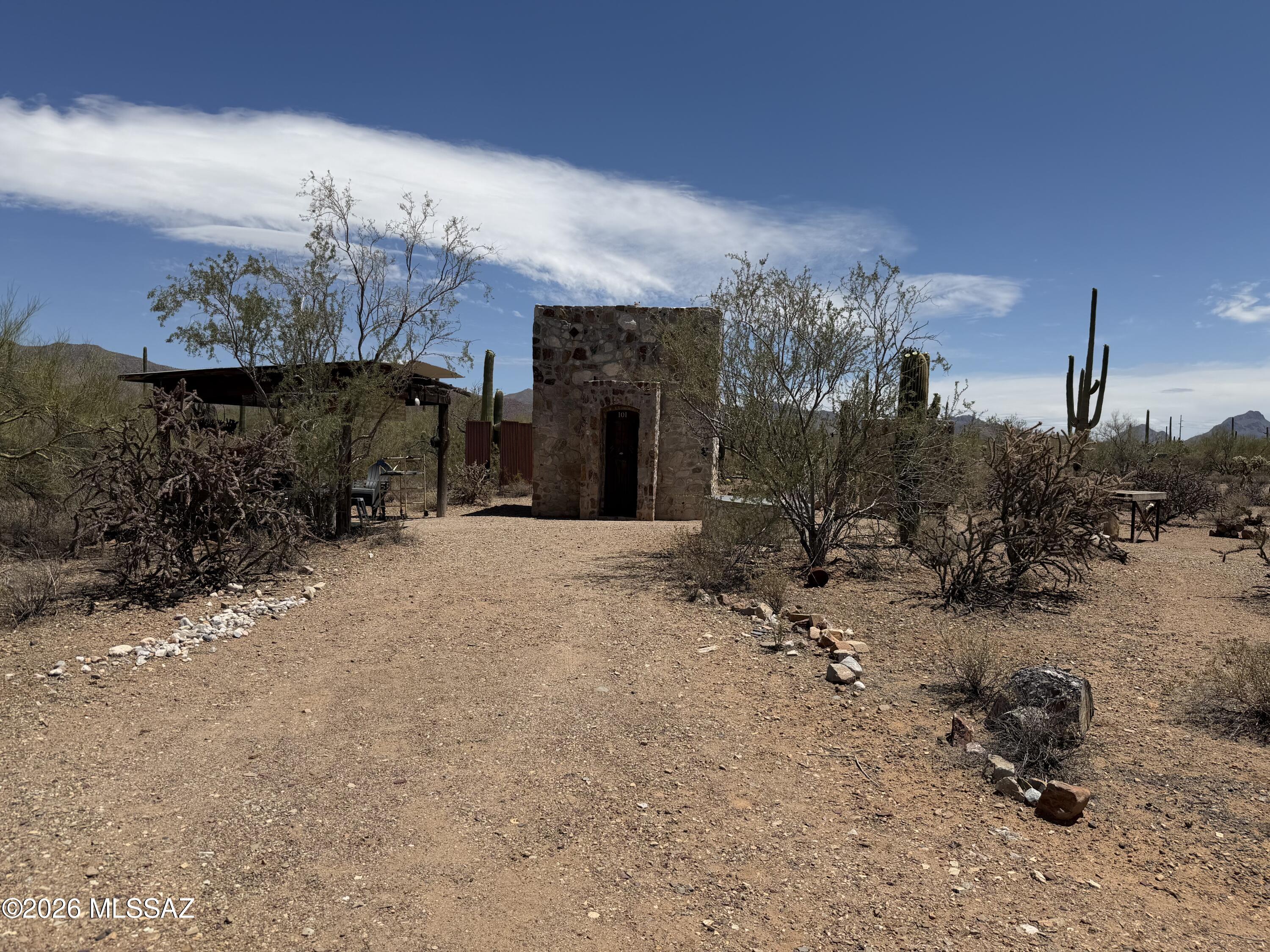 11530 West Sinagua Road Tucson, AZ 85743 - Photo 6 of 9 a view of a house with a snow in the yard
