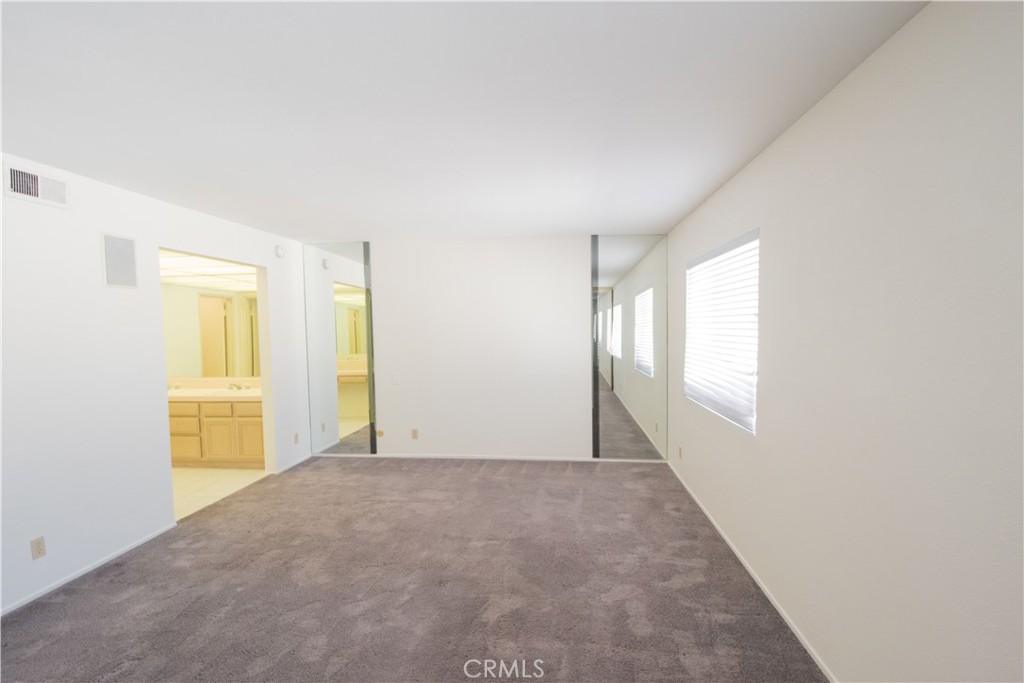 18340 Collins Street, Unit E Tarzana, CA 91356 - Photo 14 of 29 a view of an empty room with a window