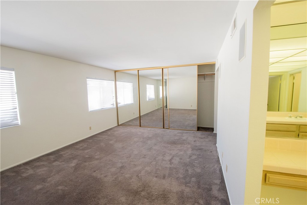18340 Collins Street, Unit E Tarzana, CA 91356 - Photo 15 of 29 a view of an empty room with a window