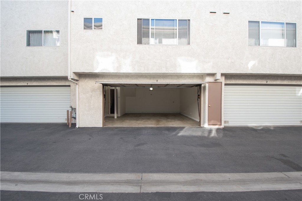 18340 Collins Street, Unit E Tarzana, CA 91356 - Photo 23 of 29 a view of room with cabinets and a fireplace