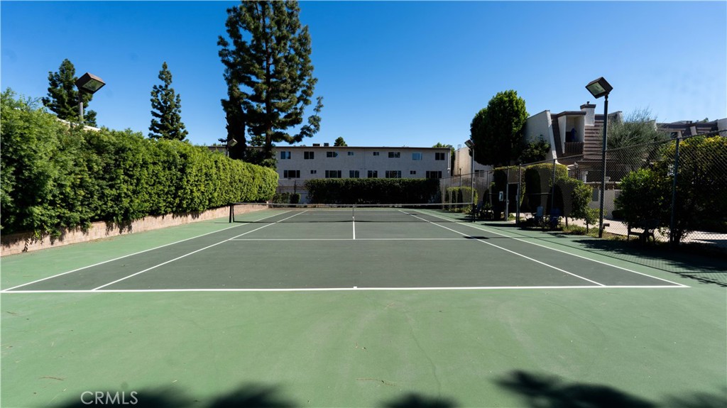 18340 Collins Street, Unit E Tarzana, CA 91356 - Photo 25 of 29 a view of a tennis court