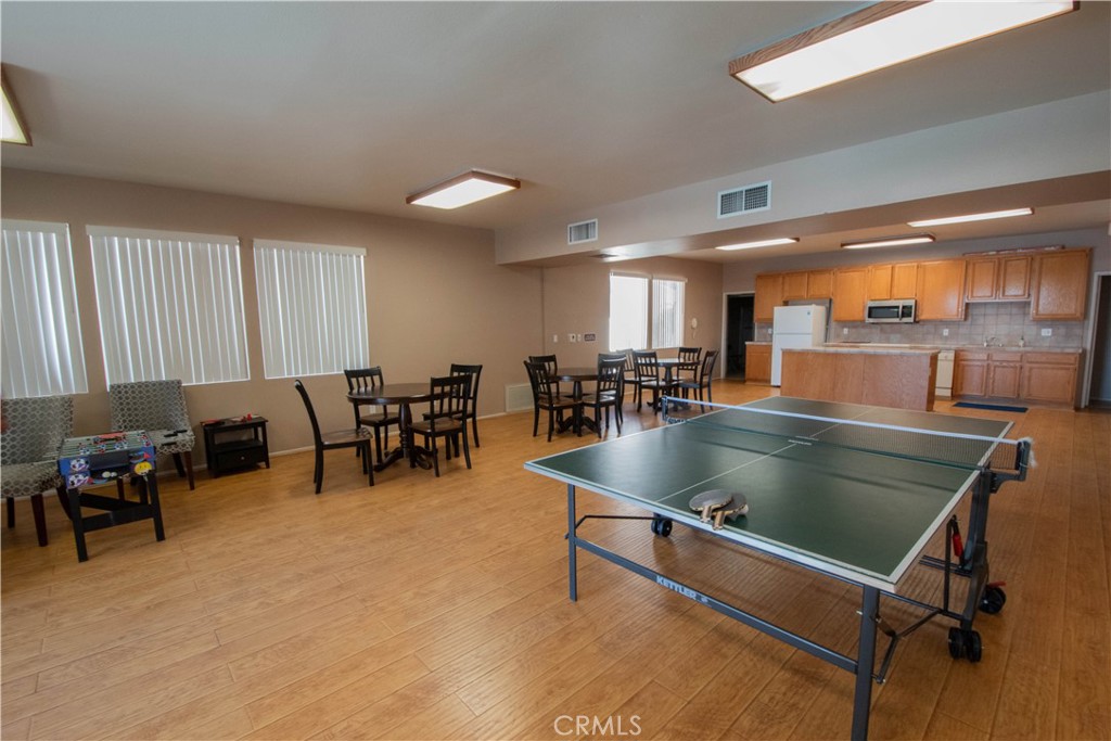 18340 Collins Street, Unit E Tarzana, CA 91356 - Photo 28 of 29 a room with lots of furniture pool table and chairs