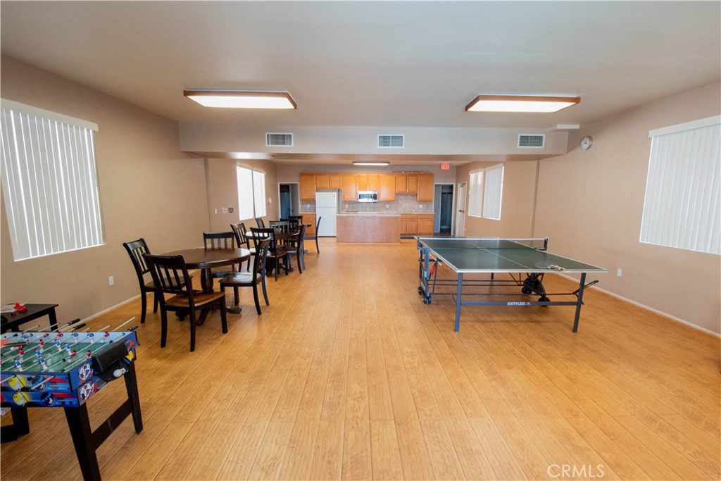 18340 Collins Street, Unit E Tarzana, CA 91356 - Photo 29 of 29 a living room with furniture and a table