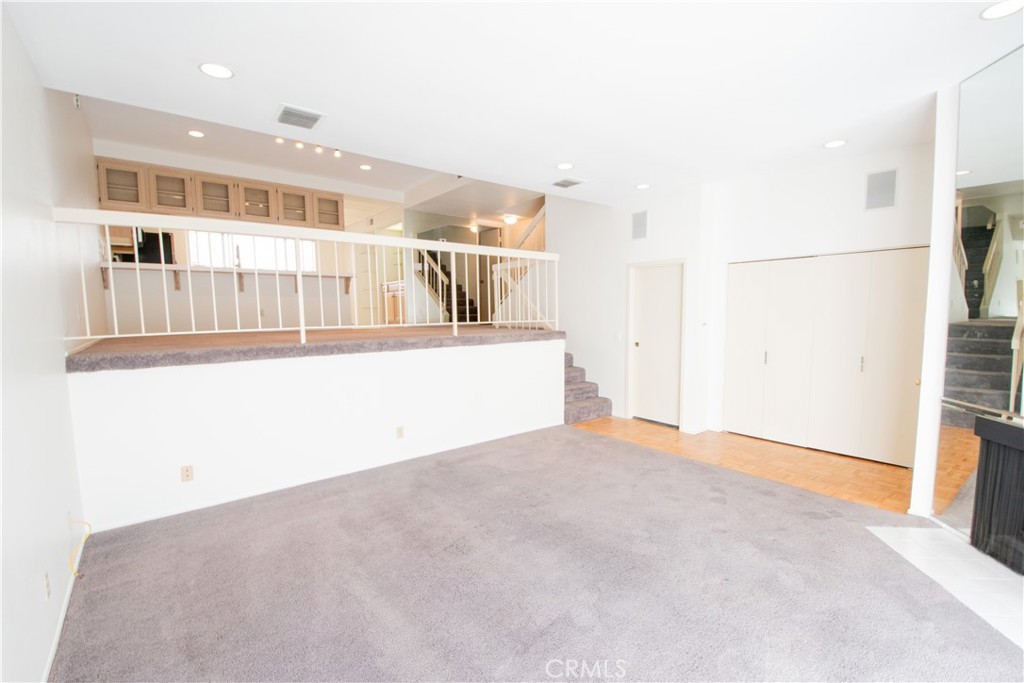 18340 Collins Street, Unit E Tarzana, CA 91356 - Photo 7 of 29 an empty room with windows