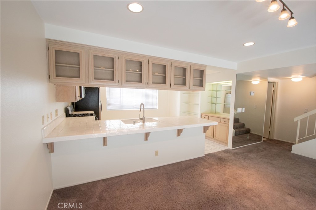 18340 Collins Street, Unit E Tarzana, CA 91356 - Photo 8 of 29 a view of kitchen with refrigerator and window