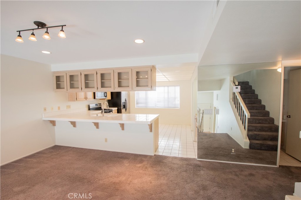 18340 Collins Street, Unit E Tarzana, CA 91356 - Photo 10 of 29 a view of kitchen with sink cabinets and window
