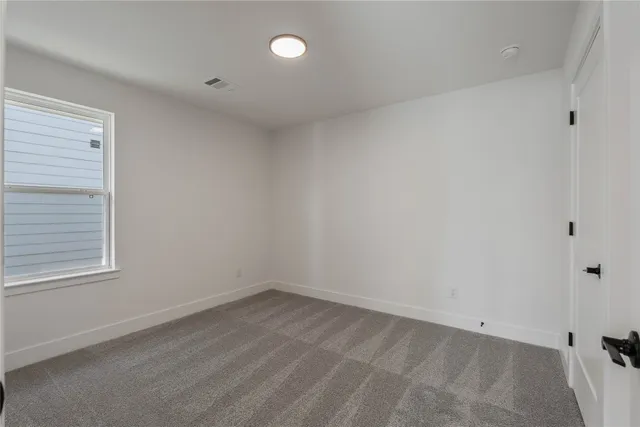 a view of room with wooden floor