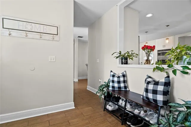 a room with furniture and a potted plant