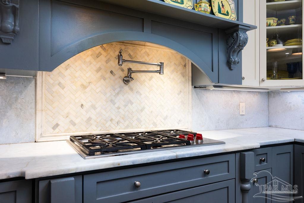 714 East La Rua Street Pensacola, FL 32501 - Photo 22 of 63 a close view of a stove a sink and a table in a kitchen