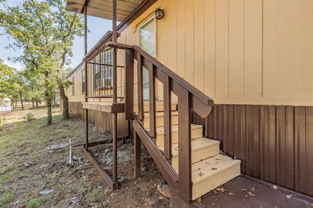 419 Wood River Road Millsap, TX 76066 - Photo 36 of 36 a view of entryway with wooden stairs