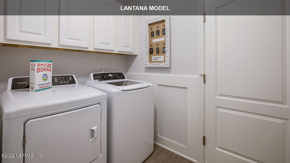 65736 Edgewater Drive Yulee, FL 32097 - Photo 16 of 44 a utility room with dryer and washer