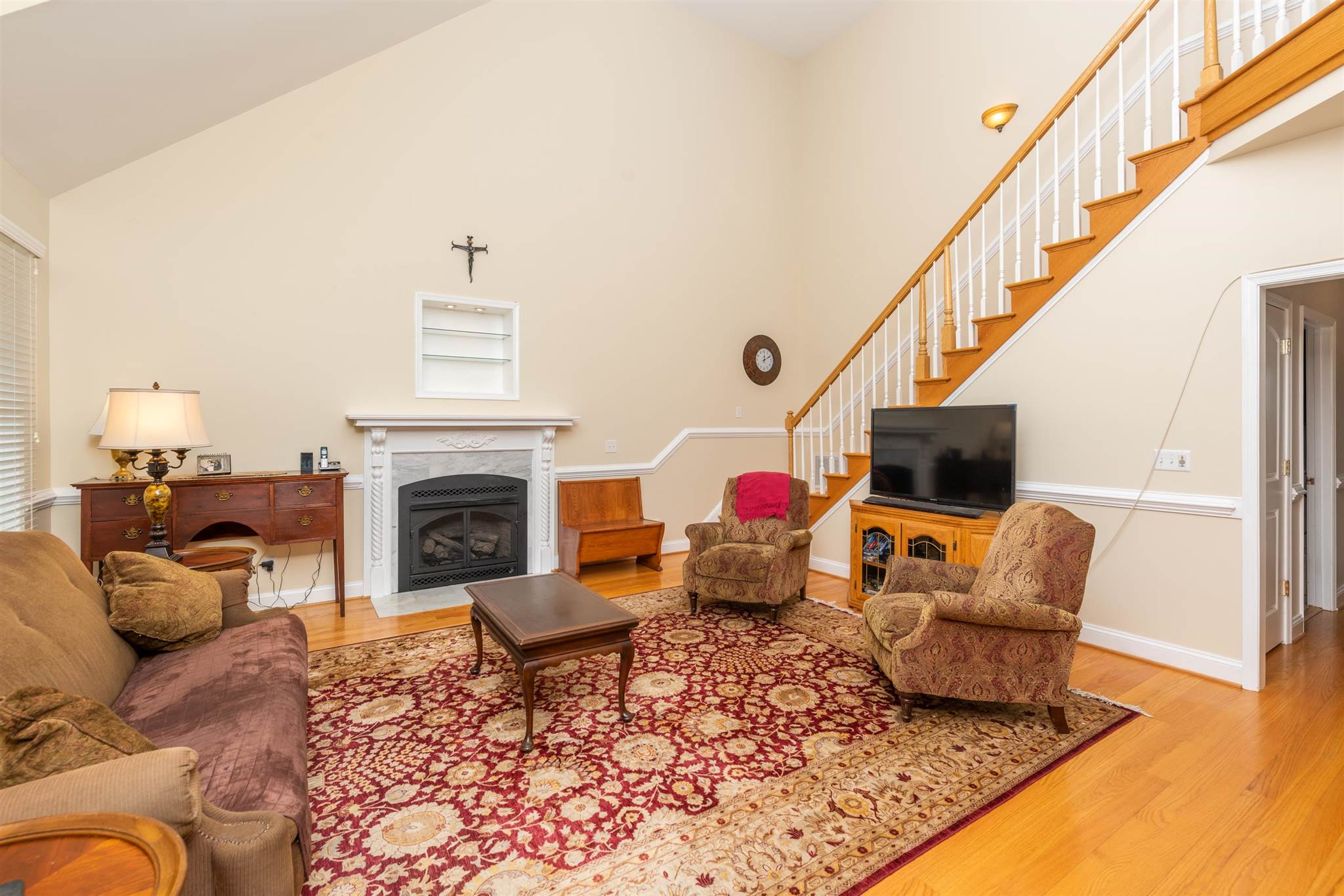 60 Koogler Trail Raphine, VA 24472 - Photo 41 of 75 a living room with furniture a fireplace and a flat screen tv