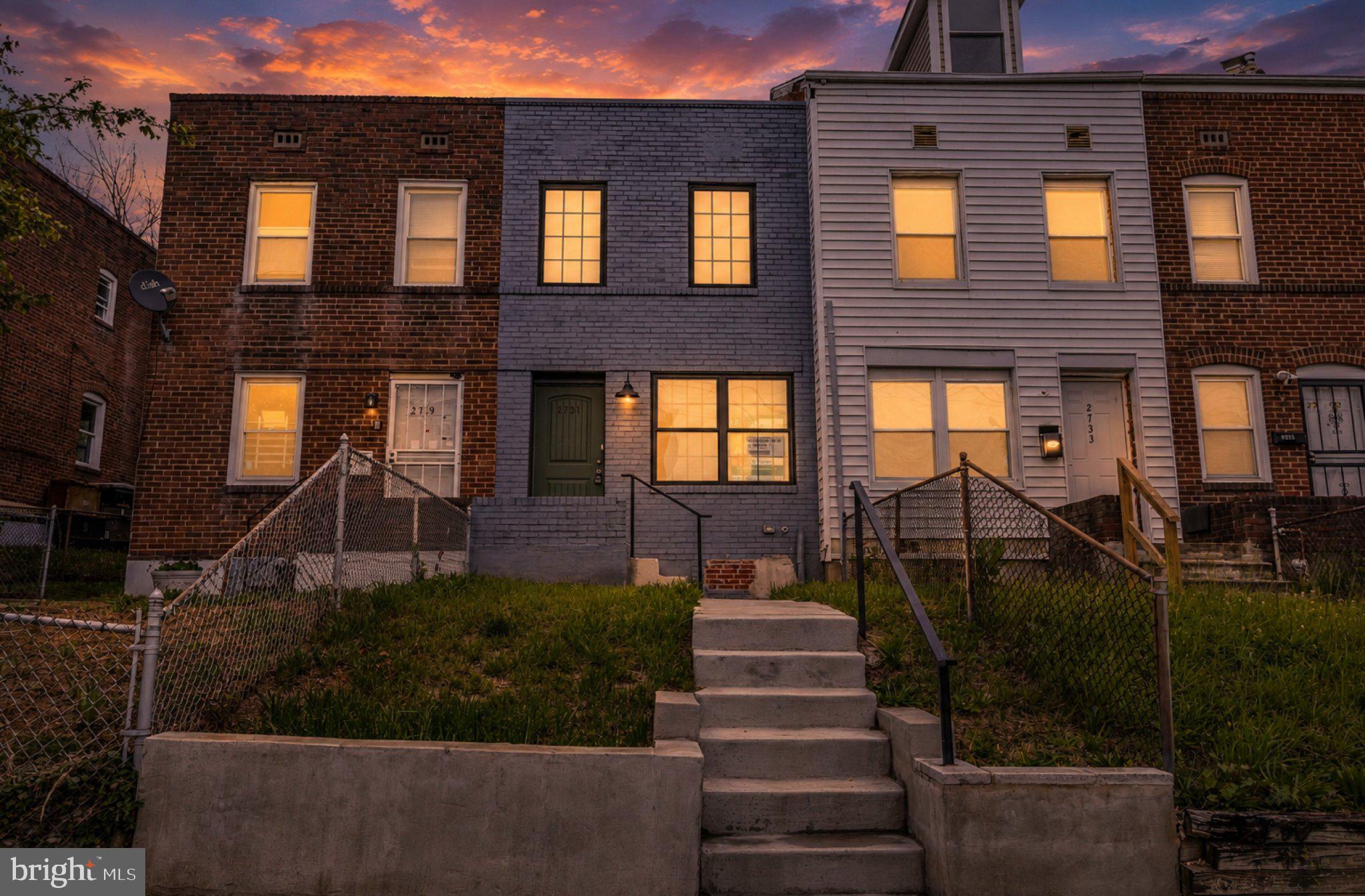 2731 Round Road Baltimore, MD 21225 - Photo 24 of 26 Charming row homes at sunset glow.