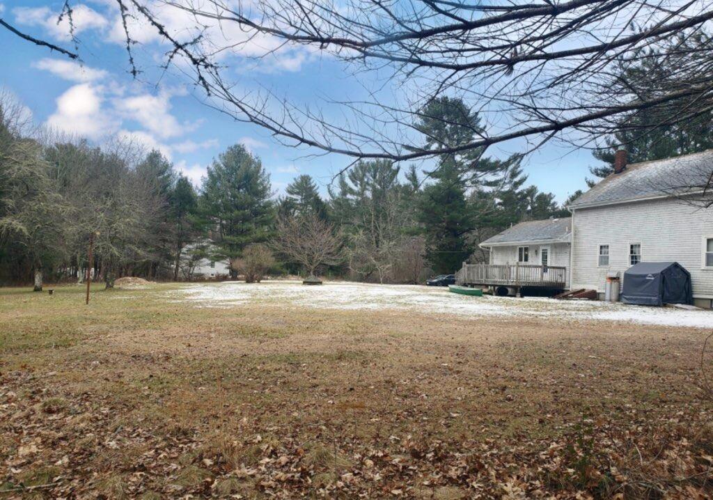 912 Walnut Plain Road Rochester, MA 02770 - Photo 1 of 20 a dirt road with large trees