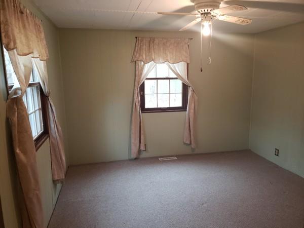 912 Walnut Plain Road Rochester, MA 02770 - Photo 11 of 20 an empty room with windows and entrance