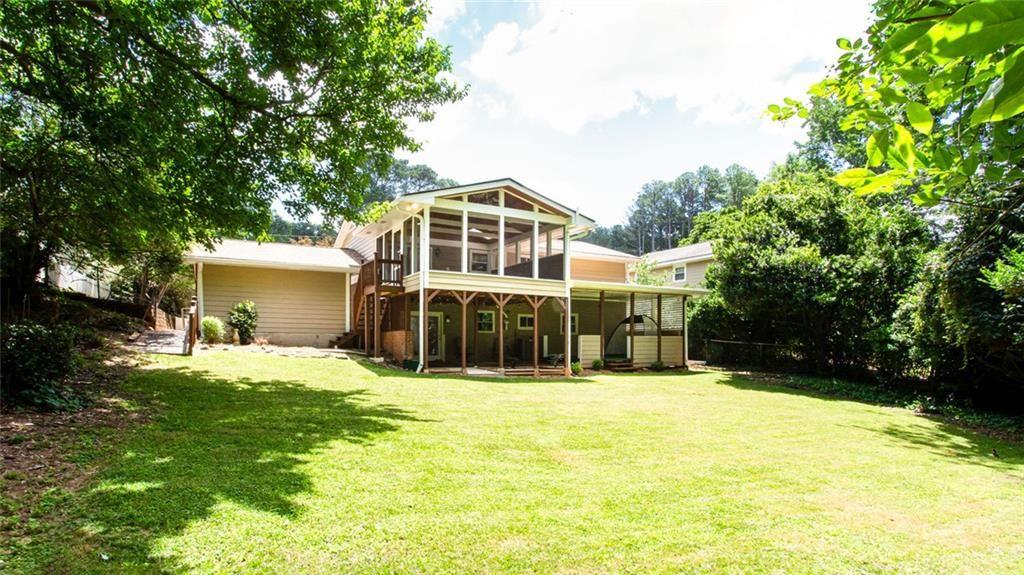 2814 Goodfellows Road Tucker, GA 30084 - Photo 43 of 46 a view of a house with a yard and large trees