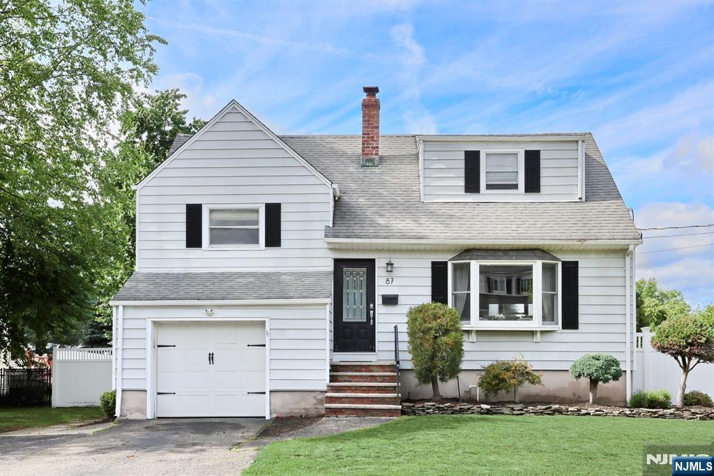 87 Barbara Road Dumont, NJ 07628 - Photo 2 of 48 a house view with a garden space