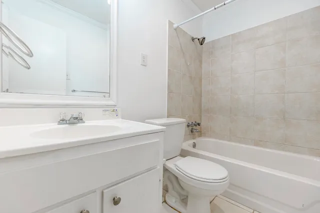 a bathroom with a sink a toilet and a bathtub