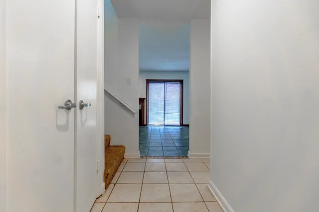 a view of a hallway with closet