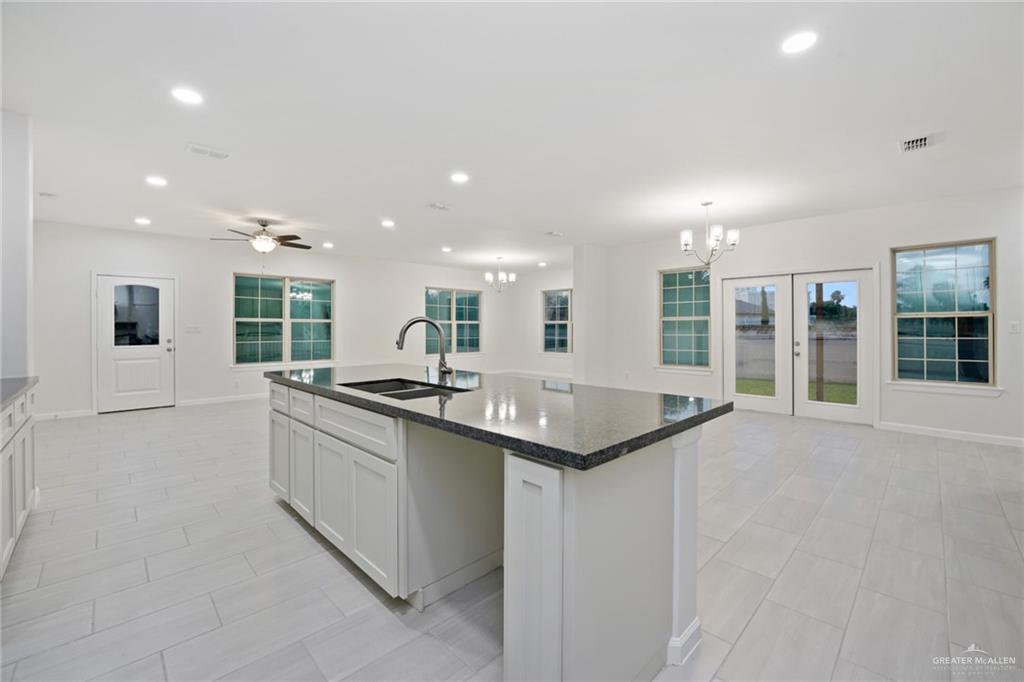 2906 Alcala Court Mission, TX 78572 - Photo 7 of 17 a kitchen with stainless steel appliances granite countertop a sink and a stove