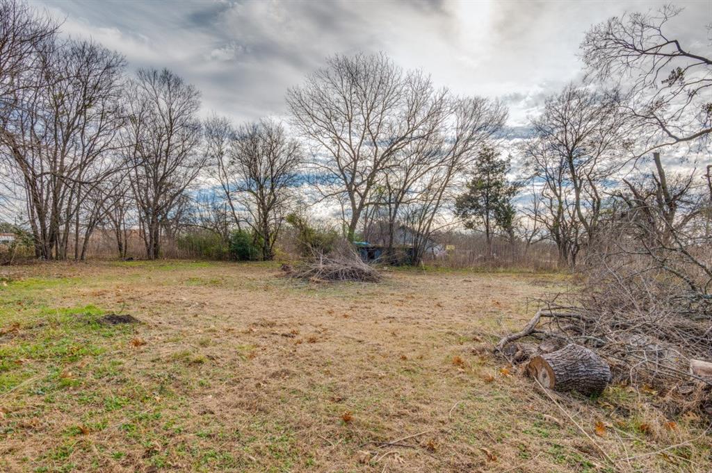 208 West 9th Street Kemp, TX 75143 - Photo 13 of 13 a view of outdoor space with deck and yard
