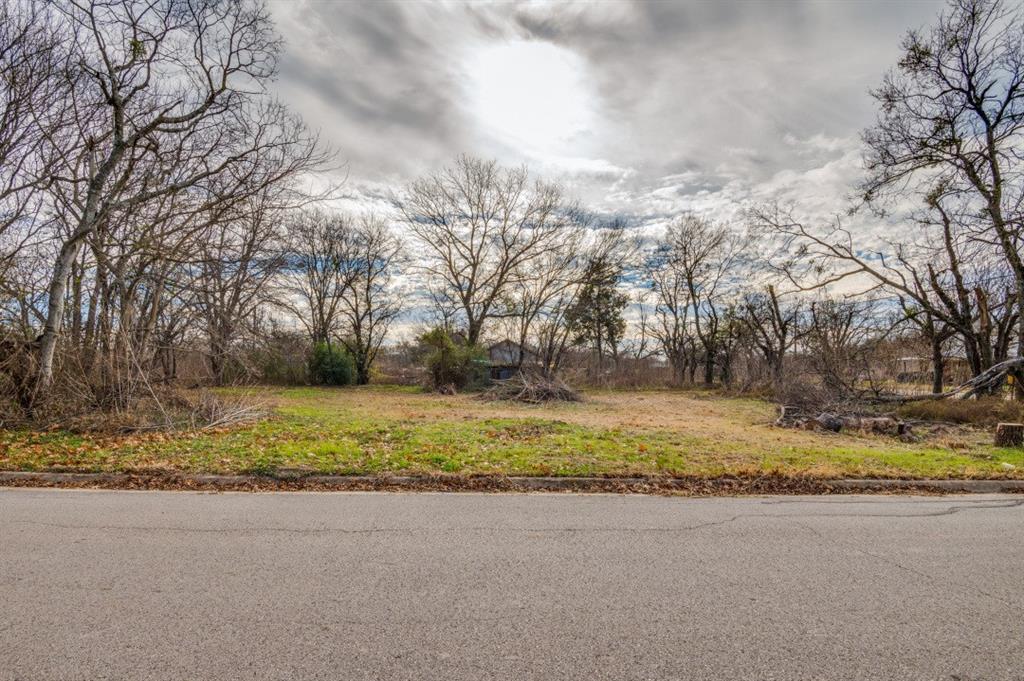 208 West 9th Street Kemp, TX 75143 - Photo 2 of 13 a view of dirt yard and a large trees
