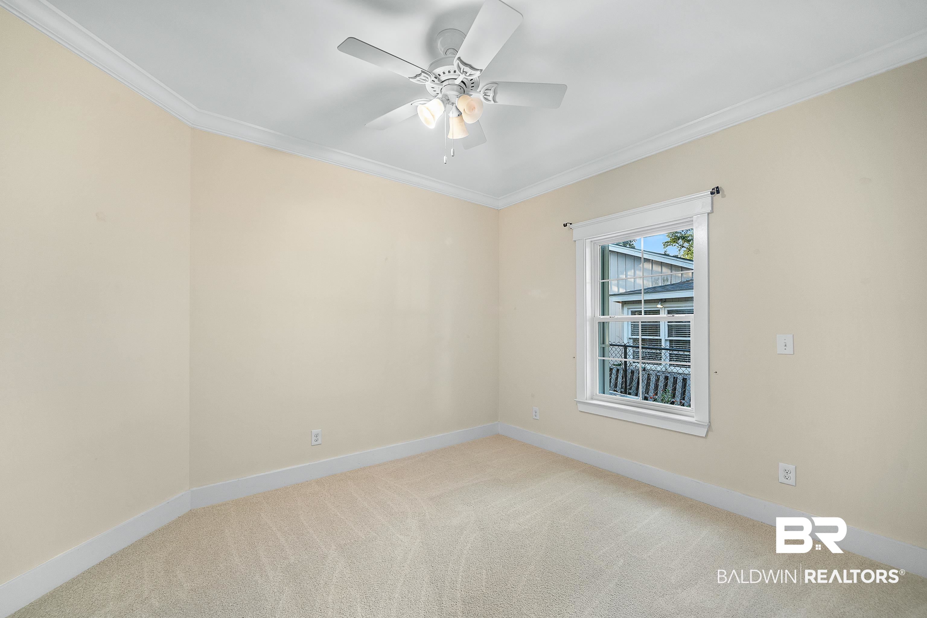 356 Liberty Street Fairhope, AL 36532 - Photo 21 of 39 Unfurnished room with crown molding, light colored carpet, and ceiling fan