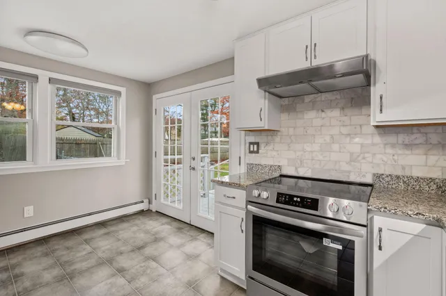 a kitchen with stainless steel appliances a stove and a refrigerator