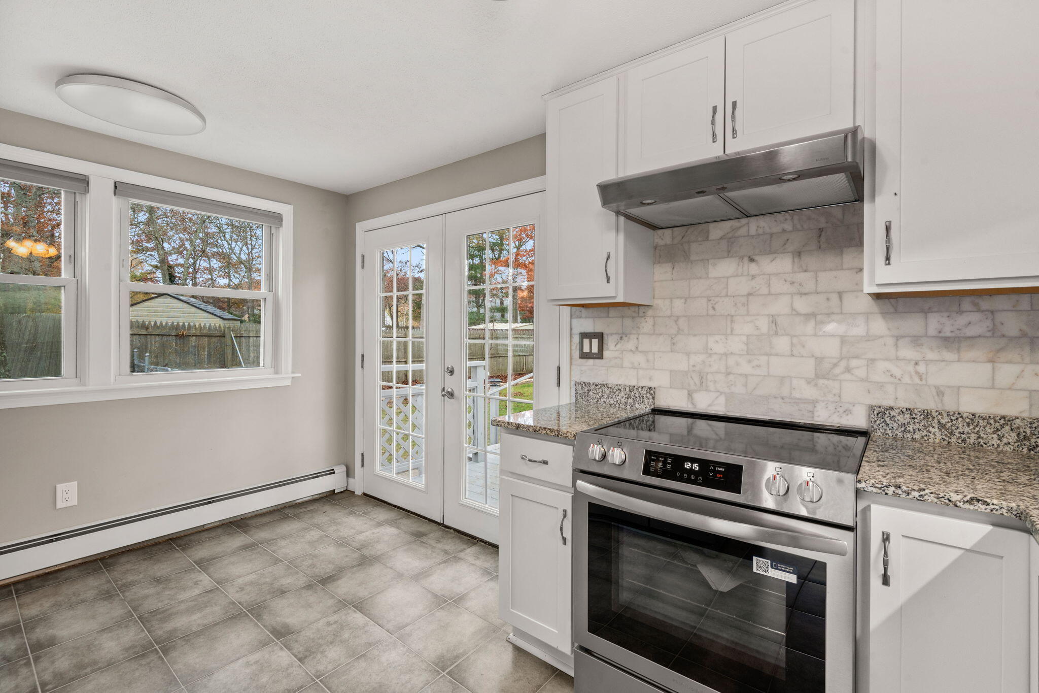 130 Old Barnstable Road East Falmouth, MA 02536 - Photo 12 of 34 a kitchen with stainless steel appliances a stove and a refrigerator