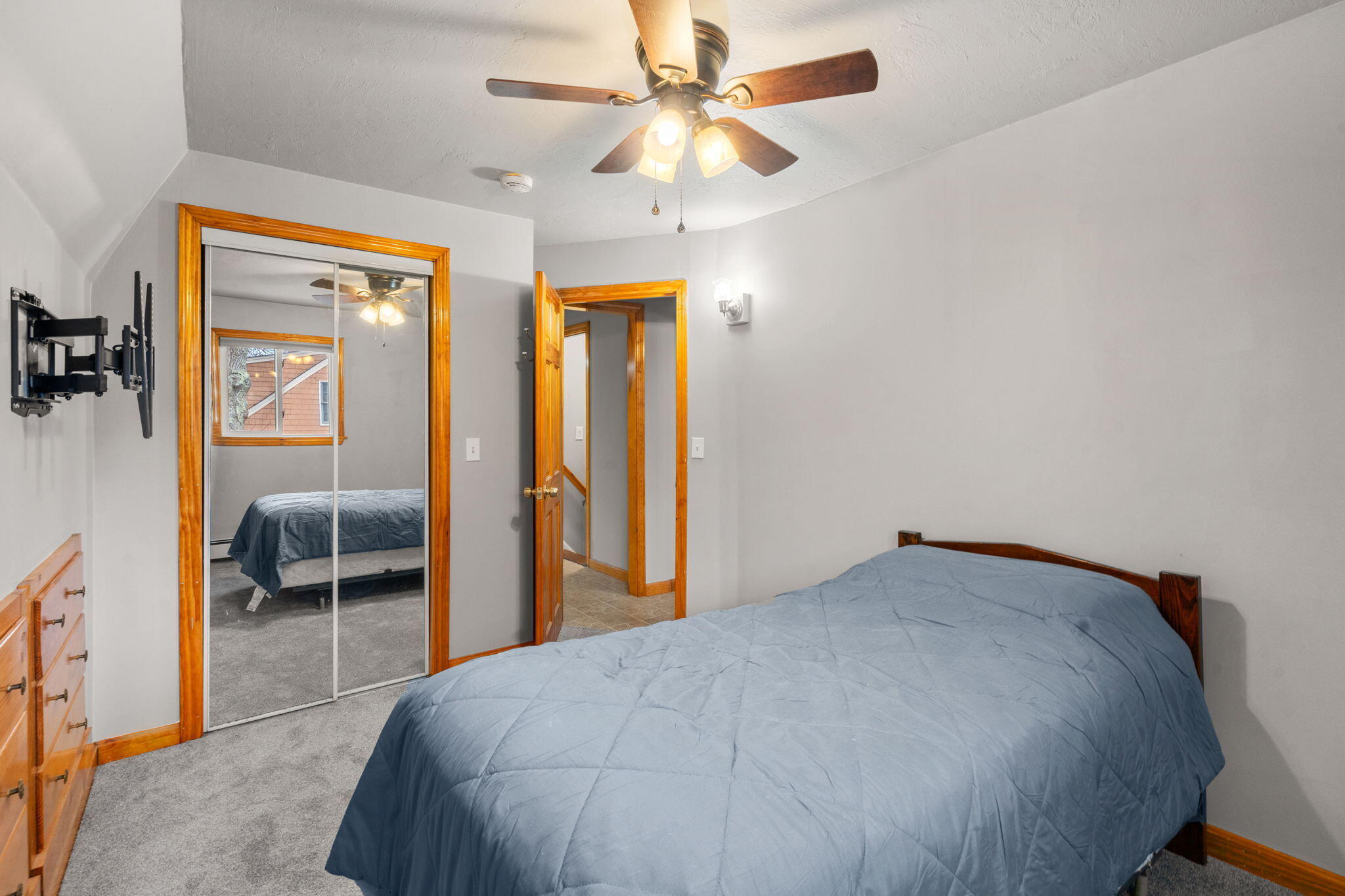 130 Old Barnstable Road East Falmouth, MA 02536 - Photo 13 of 34 a bedroom with a bed and a chandelier