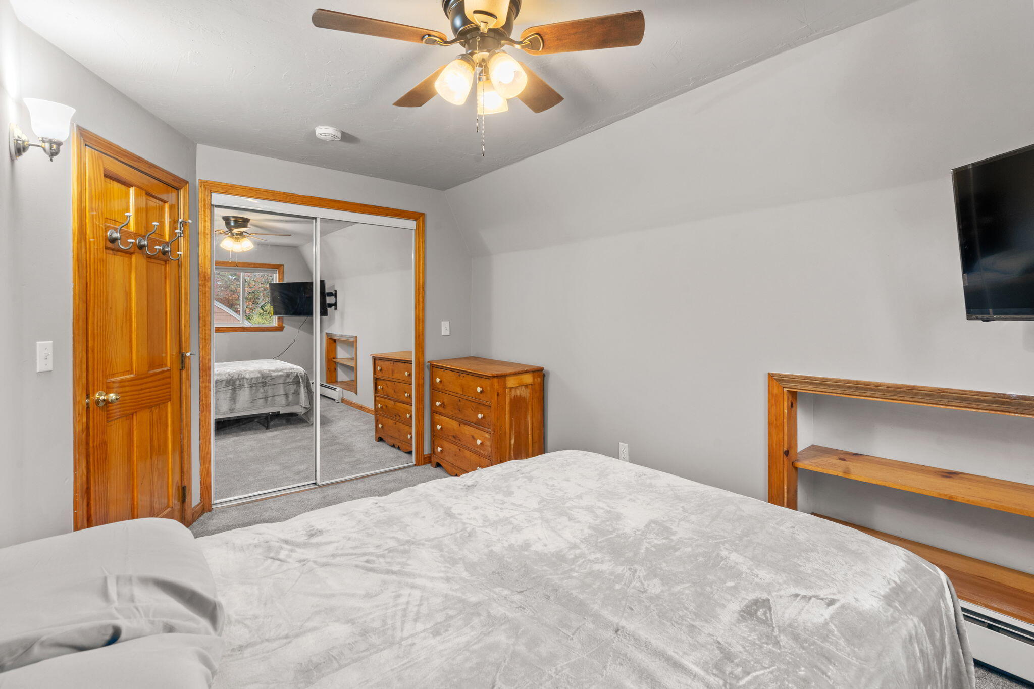 130 Old Barnstable Road East Falmouth, MA 02536 - Photo 16 of 34 a bedroom with a bed and a flat tv screen