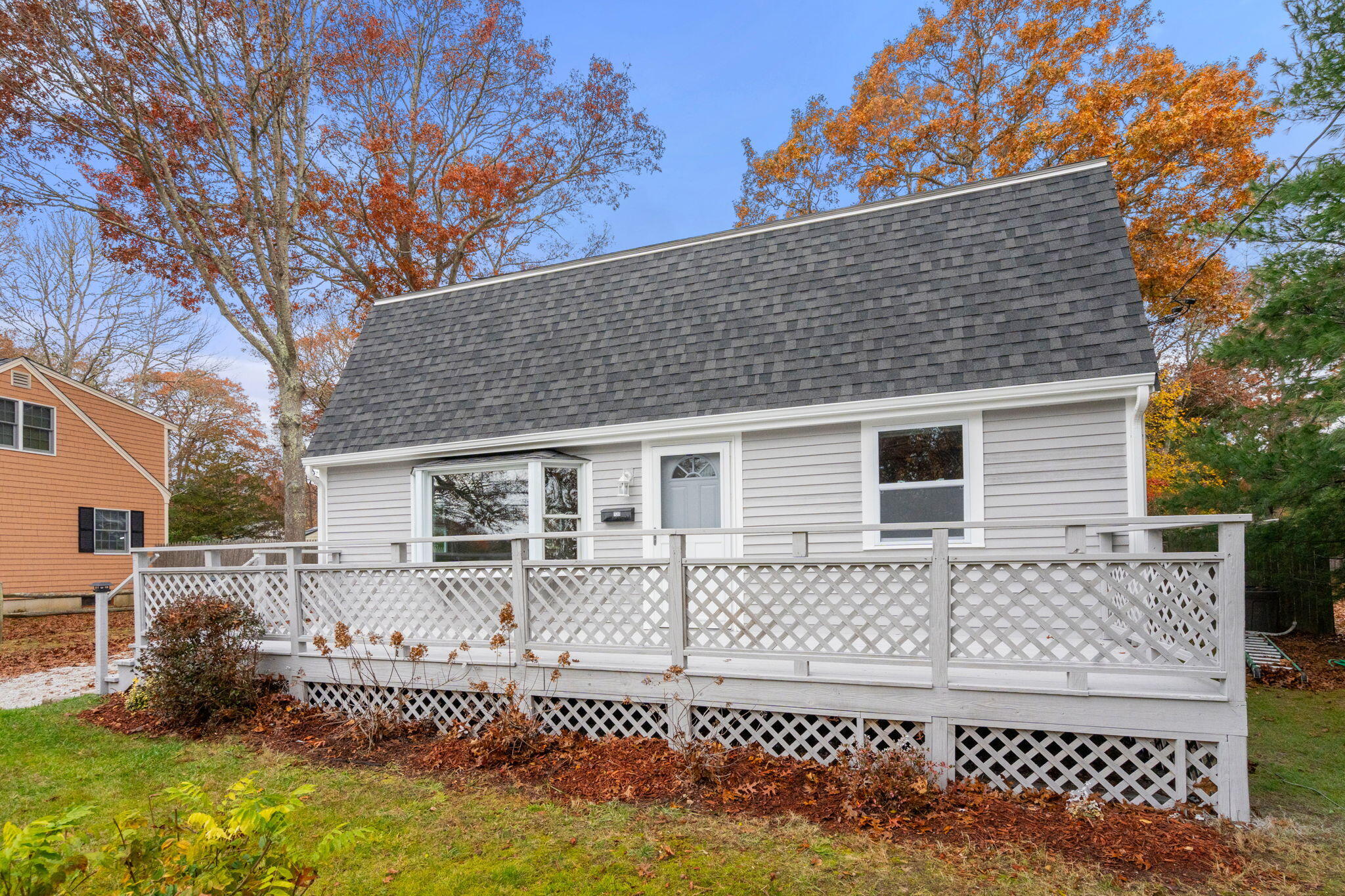 130 Old Barnstable Road East Falmouth, MA 02536 - Photo 2 of 34 a front view of a house with a yard