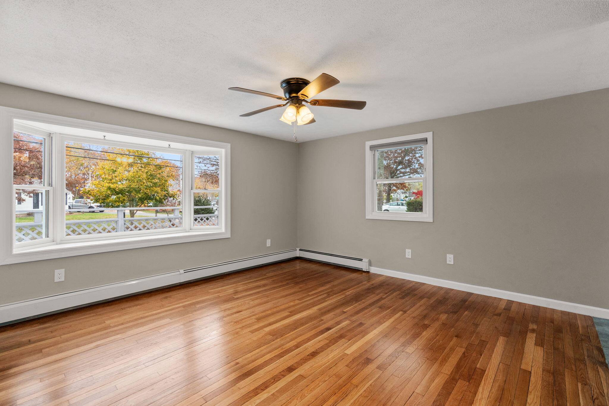 130 Old Barnstable Road East Falmouth, MA 02536 - Photo 6 of 34 wooden floor in an empty room with a window