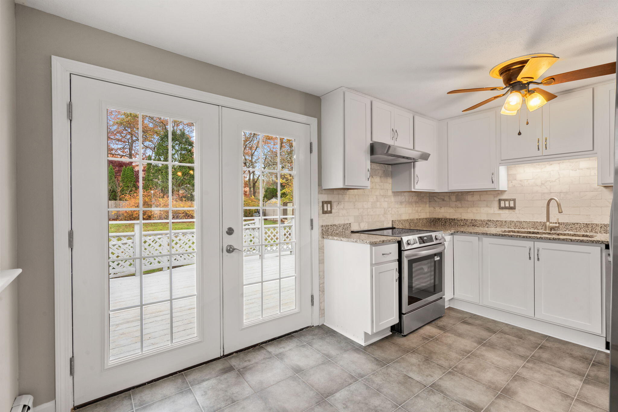 130 Old Barnstable Road East Falmouth, MA 02536 - Photo 9 of 34 a kitchen with stainless steel appliances granite countertop a stove a sink and a refrigerator