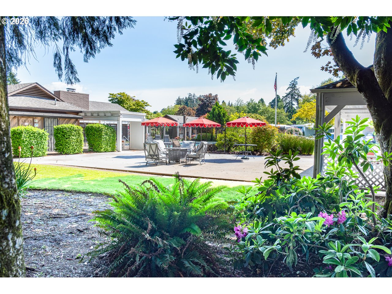 1475 Green Acres Road, Unit 172 Eugene, OR 97408 - Photo 28 of 35 a view of swimming pool with outdoor seating and a garden
