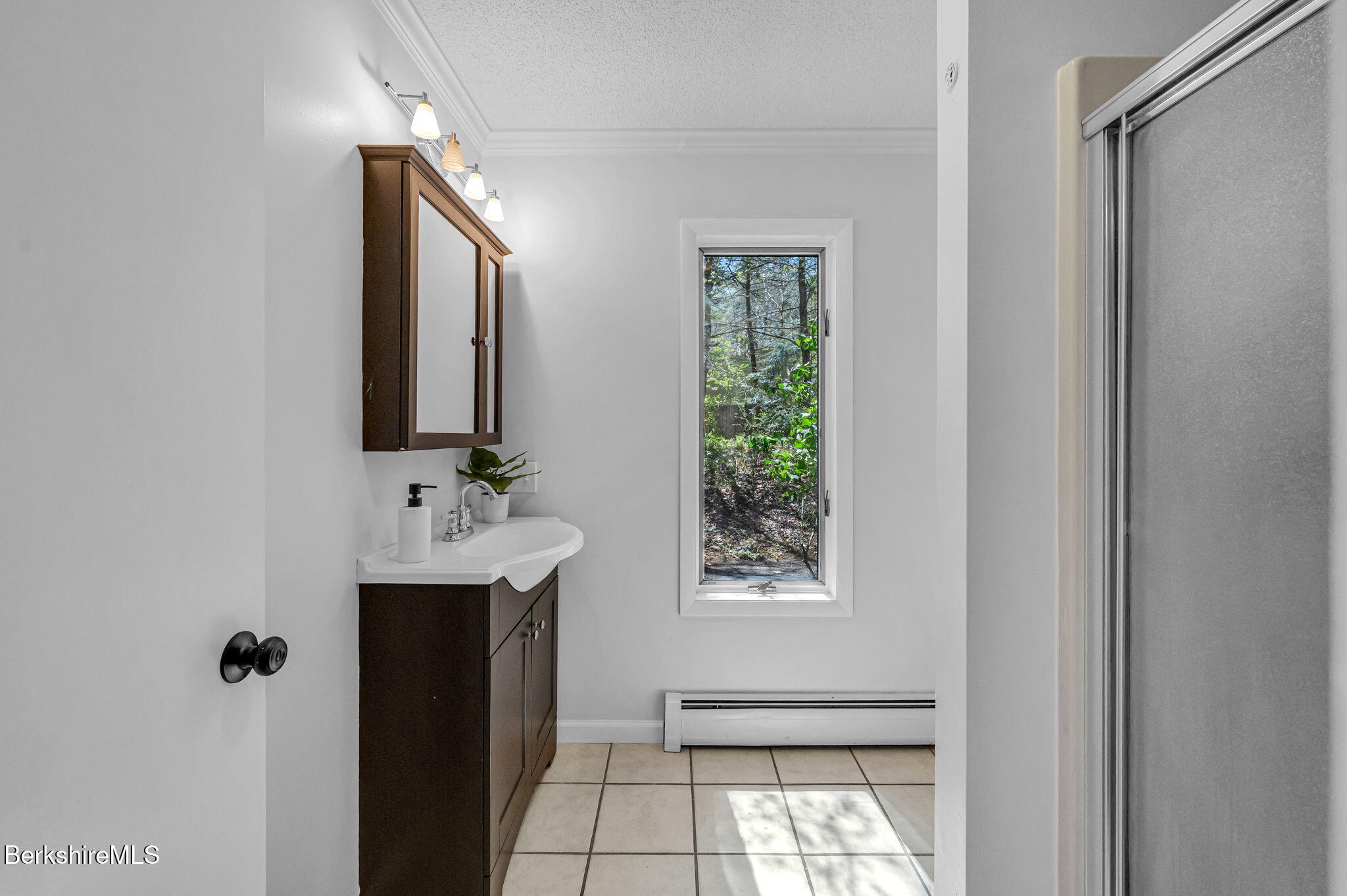 1874 Home Road Sheffield, MA 01230 - Photo 27 of 42 a bathroom with a sink a mirror and window