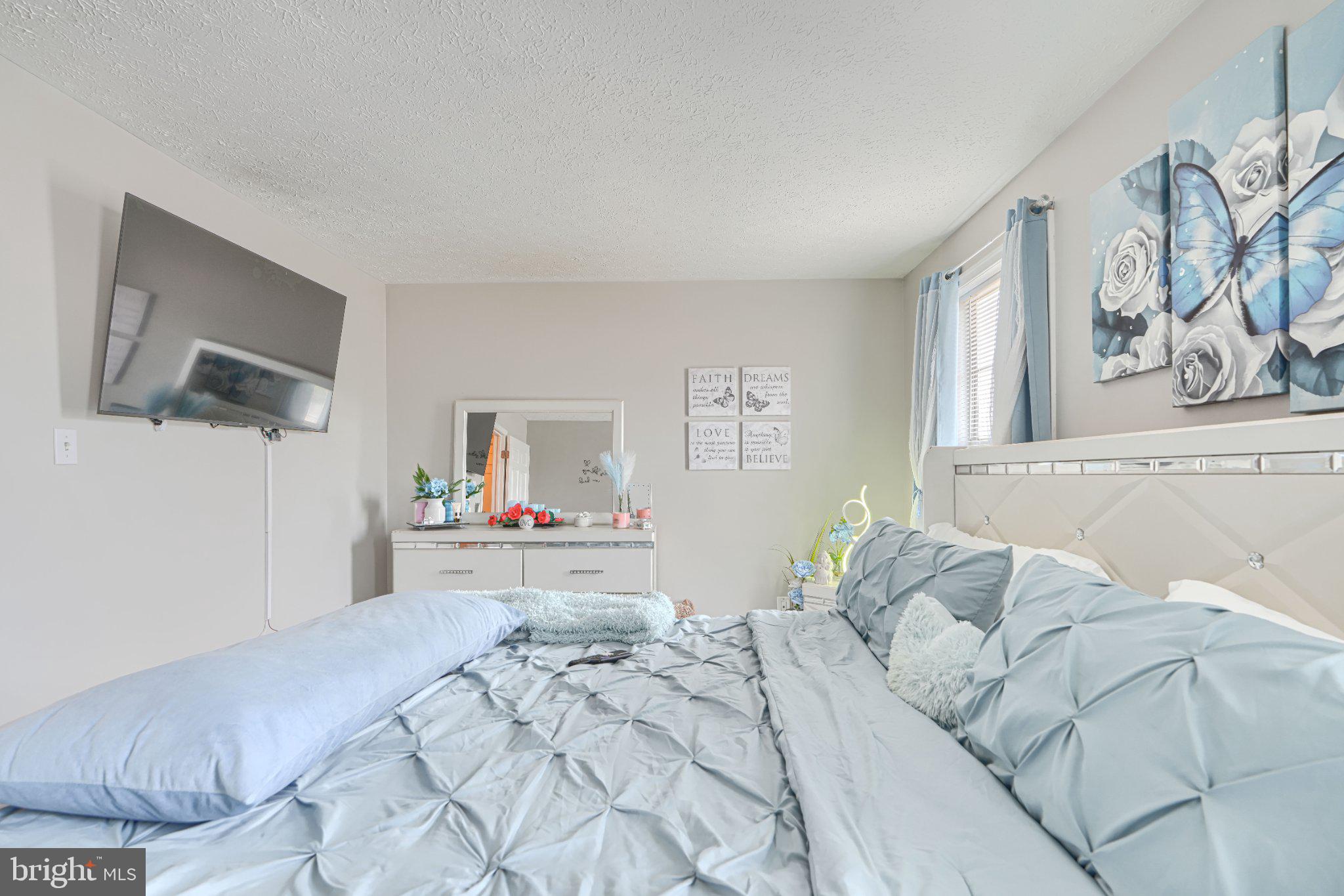 4067 Rustico Road Baltimore, MD 21220 - Photo 23 of 31 Serene bedroom with butterfly decor.