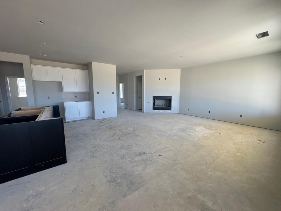 111 Brandywine Trail Rhome, TX 76078 - Photo 5 of 13 a view of empty room with a fireplace
