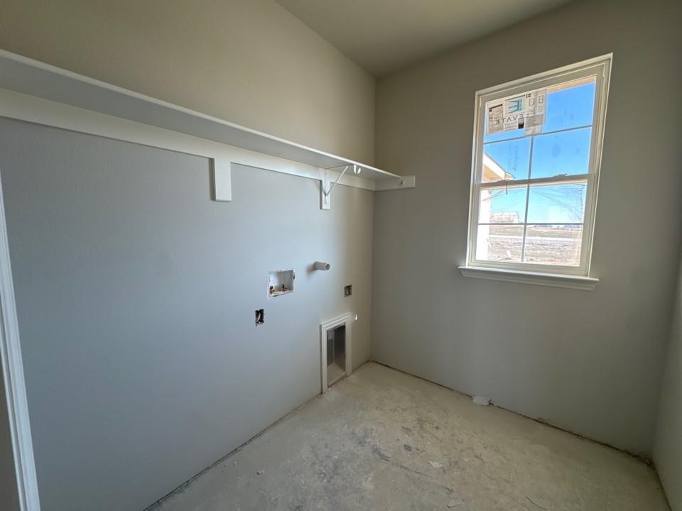 111 Brandywine Trail Rhome, TX 76078 - Photo 6 of 13 a view of an empty room with a window