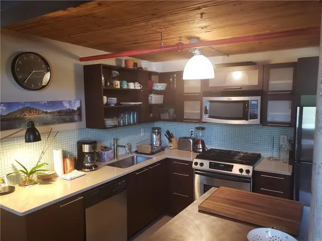 a kitchen with a cabinets and appliances