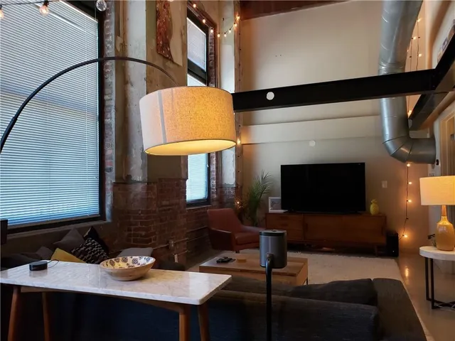 a living room with a couch and a flat screen tv