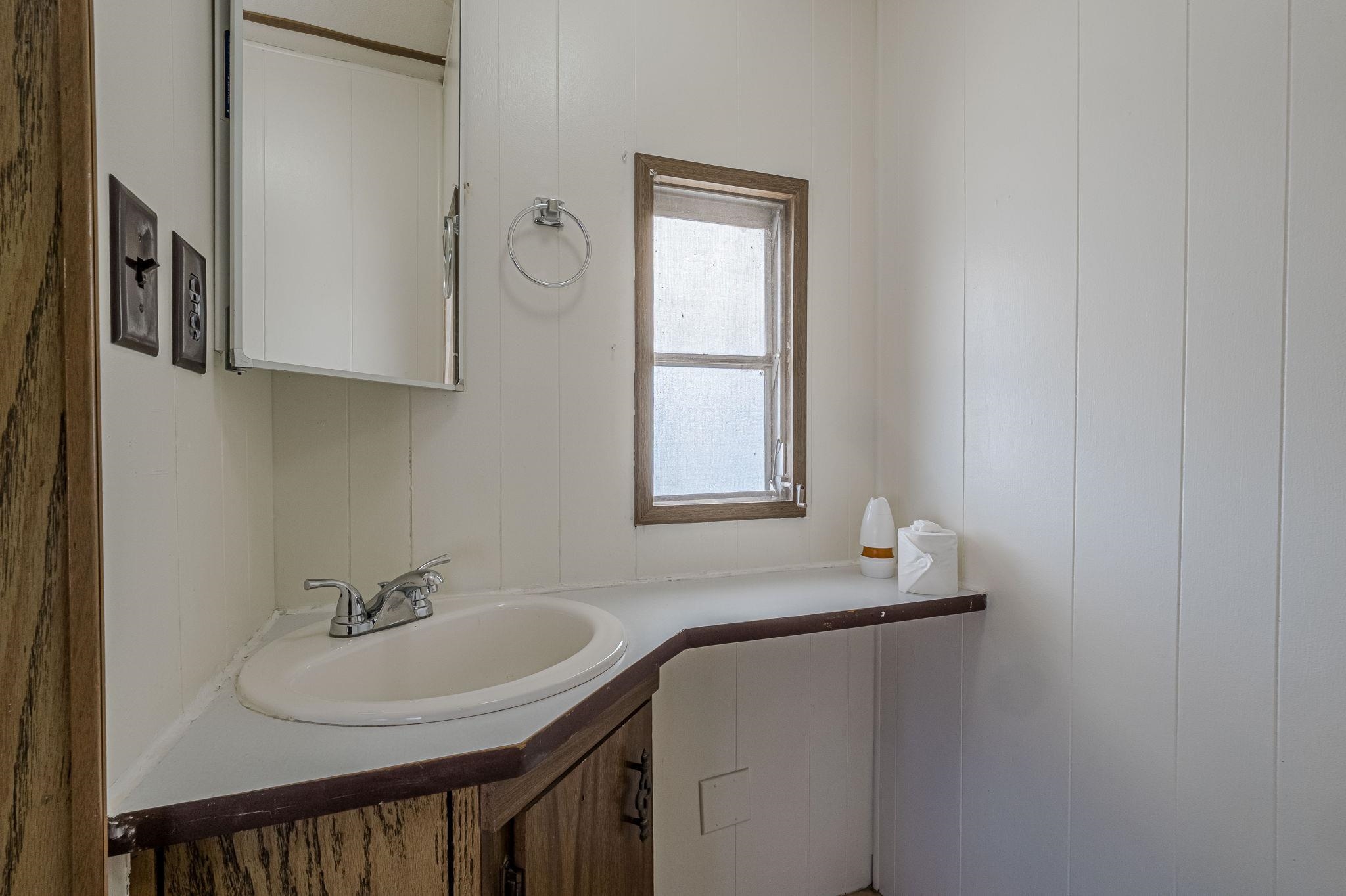 3251 E Road, Unit 22 Clifton, CO 81520 - Photo 13 of 29 a bathroom with a sink and a mirror