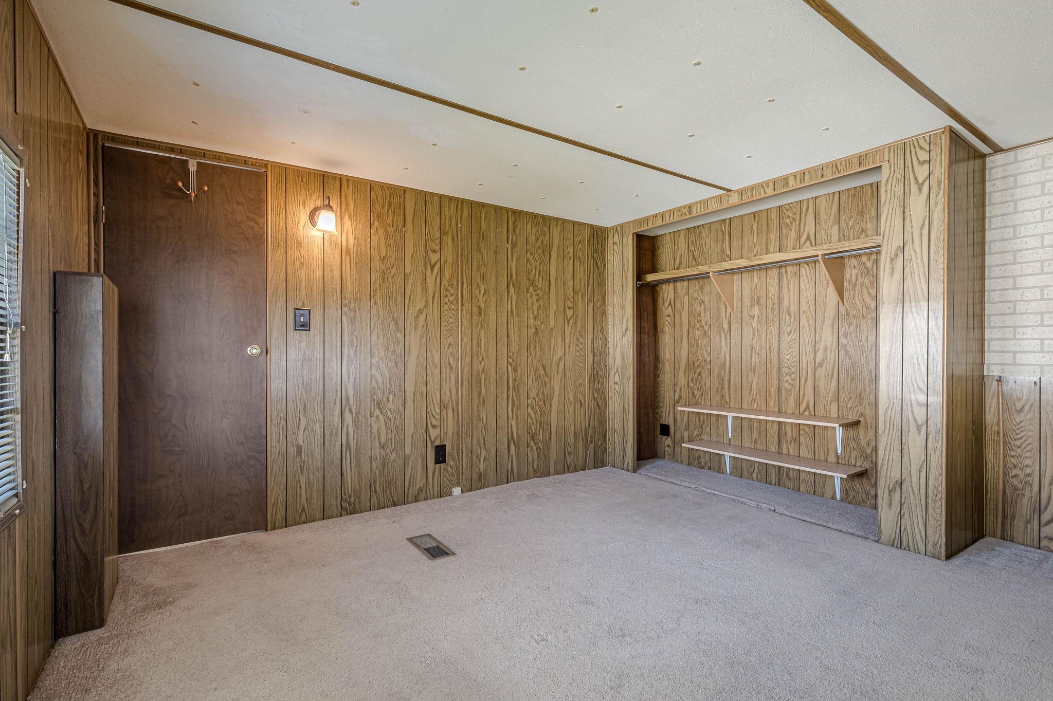 3251 E Road, Unit 22 Clifton, CO 81520 - Photo 15 of 29 a view of empty room with wooden walls