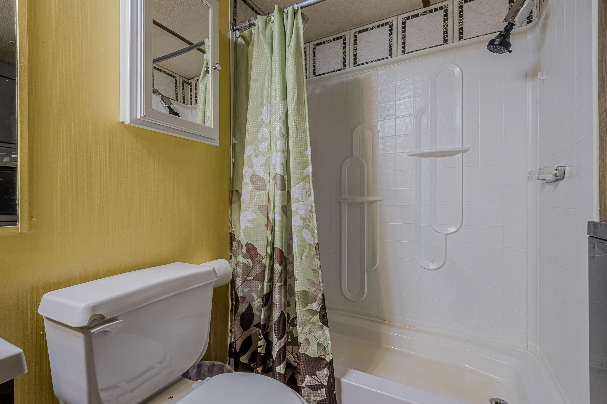 3251 E Road, Unit 22 Clifton, CO 81520 - Photo 19 of 29 a bathroom with a shower and a toilet